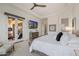 Luxurious main bedroom featuring French doors and a modern ceiling fan at 11796 W Creosote Dr, Peoria, AZ 85383