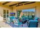 Outdoor patio with comfortable seating, a ceiling fan, tv and mountain views at 11796 W Creosote Dr, Peoria, AZ 85383