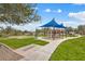 The colorful community playground with modern equipment and shade, fosters active play and creates lasting memories at 11796 W Creosote Dr, Peoria, AZ 85383