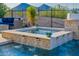 Custom pool and spa with water features, enhancing the backyard oasis, and desert views at 11796 W Creosote Dr, Peoria, AZ 85383