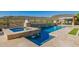Beautiful swimming pool and spa featuring stone accents, water features, and desert views at 11796 W Creosote Dr, Peoria, AZ 85383