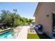 Charming back porch with an outdoor sitting area and a view of the pool and lush backyard at 1204 S Arroya Cir, Mesa, AZ 85206