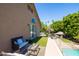 Relaxing back porch featuring comfortable seating and picturesque views of the pool and landscape at 1204 S Arroya Cir, Mesa, AZ 85206