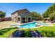 Sprawling backyard with a freeform pool, spa, well-manicured lawn, and ample lounge space at 1204 S Arroya Cir, Mesa, AZ 85206