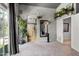 Open bedroom with a sliding glass door, hanging plants, and neutral colored carpet at 1204 S Arroya Cir, Mesa, AZ 85206