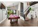 Spacious game room featuring a pool table, high ceilings, staircase, and backyard views at 1204 S Arroya Cir, Mesa, AZ 85206
