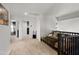 Bright hallway featuring neutral carpeting, white trim, and access to multiple rooms at 1204 S Arroya Cir, Mesa, AZ 85206