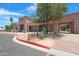 Inviting community center entrance with desert landscaping and clear signage at 15971 W Indigo Ln, Surprise, AZ 85374