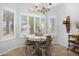 Charming dining area with natural light, shutters, and seating for four at 15971 W Indigo Ln, Surprise, AZ 85374