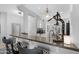 Stylish kitchen bar featuring countertops, seating, and white cabinets at 15971 W Indigo Ln, Surprise, AZ 85374