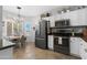 Inviting kitchen features stainless steel appliances and an adjacent dining area at 15971 W Indigo Ln, Surprise, AZ 85374