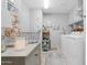 Bright laundry room with updated washer and dryer at 15971 W Indigo Ln, Surprise, AZ 85374