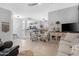 Living room view leading to an open floor plan with the bar and kitchen area at 15971 W Indigo Ln, Surprise, AZ 85374