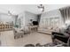 Bright living room featuring tile floors, natural light, and backyard access at 15971 W Indigo Ln, Surprise, AZ 85374