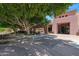 Picturesque outdoor seating area with mature trees providing ample shade for a relaxing experience at 15971 W Indigo Ln, Surprise, AZ 85374