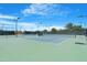 Community tennis courts with well-maintained surfaces and lighting for evening play at 15971 W Indigo Ln, Surprise, AZ 85374