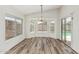 Open dining area with natural light, modern flooring, and backyard views at 16333 W Paradise Ln, Surprise, AZ 85388
