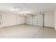 Spacious garage with sealed concrete floors at 16333 W Paradise Ln, Surprise, AZ 85388