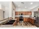 Well-lit kitchen featuring stainless steel appliances, and wood cabinets at 16333 W Paradise Ln, Surprise, AZ 85388