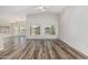 Spacious living room with modern flooring and abundant natural light at 16333 W Paradise Ln, Surprise, AZ 85388