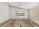 Bright, spacious main bedroom with clean lines and modern wood-look floors at 16333 W Paradise Ln, Surprise, AZ 85388