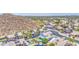 Neighborhood nestled on hill with lush green trees with mountains in the distance at 1853 N Rowen Cir, Mesa, AZ 85207