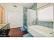 Bright bathroom showcasing a large soaking tub, a tiled glass shower, and a double vanity with ample storage at 1853 N Rowen Cir, Mesa, AZ 85207