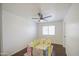 A bright and airy room with great lighting and lovely wood floors offers possibilities for customization at 1853 N Rowen Cir, Mesa, AZ 85207
