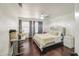 Bedroom with dark wood floors and silvery accents at 1853 N Rowen Cir, Mesa, AZ 85207