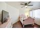 Bedroom with dark wood floors and pretty pink furniture and decor at 1853 N Rowen Cir, Mesa, AZ 85207