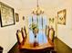 Dining room featuring a chandelier, dining table and seating for eight at 1853 N Rowen Cir, Mesa, AZ 85207