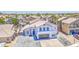 Charming two-story home featuring a meticulously paved driveway and an attached two-car garage at 1853 N Rowen Cir, Mesa, AZ 85207