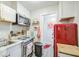 This cute kitchen offers stainless steel appliances and red accents adding character to the space at 1853 N Rowen Cir, Mesa, AZ 85207