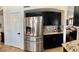 Kitchen featuring dark cabinetry, stainless steel appliances, and granite countertops at 1853 N Rowen Cir, Mesa, AZ 85207