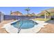 Refreshing pool with volleyball net, set in a private backyard oasis, perfect for outdoor fun and relaxation at 1853 N Rowen Cir, Mesa, AZ 85207