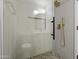 Modern bathroom shower featuring gold hardware, unique tiling, and glass door at 1881 E Kerby Farms Rd, Chandler, AZ 85249