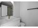 Bright bathroom featuring a marble vanity, new mirror, and modern fixtures at 1881 E Kerby Farms Rd, Chandler, AZ 85249