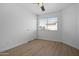 Bedroom featuring hardwood floors, a window, ceiling fan, and a closet at 1881 E Kerby Farms Rd, Chandler, AZ 85249
