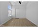 Bedroom featuring hardwood floors, natural light, and a closet at 1881 E Kerby Farms Rd, Chandler, AZ 85249