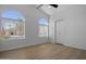 Bedroom featuring hardwood floors, arched windows with blinds, and a closet at 1881 E Kerby Farms Rd, Chandler, AZ 85249