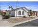 A single-story home with arched windows and desert landscaping is complemented by mature trees at 1881 E Kerby Farms Rd, Chandler, AZ 85249