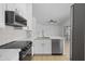 Modern kitchen featuring stainless steel appliances, white cabinetry, and a marble countertop at 1881 E Kerby Farms Rd, Chandler, AZ 85249