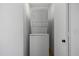 A stacked washer and dryer in a hallway at 1881 E Kerby Farms Rd, Chandler, AZ 85249