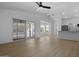 Bright open-concept living room with modern fan, sliding glass doors, and kitchen views at 1881 E Kerby Farms Rd, Chandler, AZ 85249