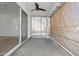Covered patio with ceiling fan, privacy shades, and sliding glass door at 1881 E Kerby Farms Rd, Chandler, AZ 85249
