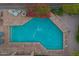 Aerial view of backyard showcasing pool, outdoor kitchen and lovely landscape providing privacy and an entertainment space at 1935 E Seminole Dr, Phoenix, AZ 85022