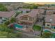 An aerial shot features a backyard oasis with a pool, fire pit, patio, and lush greenery at 1935 E Seminole Dr, Phoenix, AZ 85022
