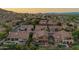 Attractive aerial view of desert homes with private pools in a lush, well-maintained neighborhood at 1935 E Seminole Dr, Phoenix, AZ 85022