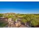 Relaxing backyard featuring a firepit and barbecue area with views of a lush golf course at 1935 E Seminole Dr, Phoenix, AZ 85022