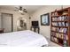 Bedroom featuring a ceiling fan, bookcase, and a door leading to a walk-in closet at 1935 E Seminole Dr, Phoenix, AZ 85022